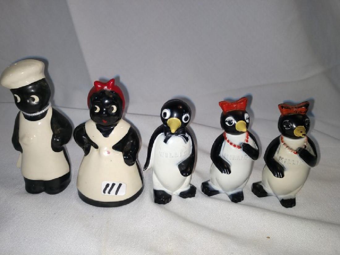 Black Americana: 5 pieces. Aunt Jemima salt and pepper, porcelain w cork and penguins Willie, 2 Millie plastic stoppers. 3 1/2" H - 4 1/4" H.