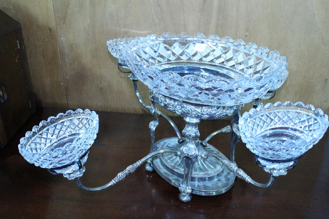 Epergne - Glass Candle Stick/Compote Set: Elegant five-bowl antique epergne. Silverplated centerpiece features intricate decoration to the base, with a large cut-glass oval bowl 12 1/2" x 9 1/2" x 4"H in the center and four incurvate stretche