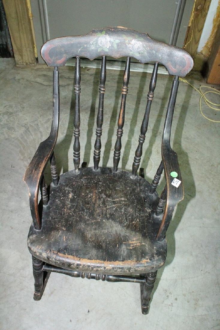 Furniture - Early Child's Rocker: Black Rocker, Hand Painted with stencil, chip of wood missing from back top of chair. Age cracks, paint missing, ornate spindols.