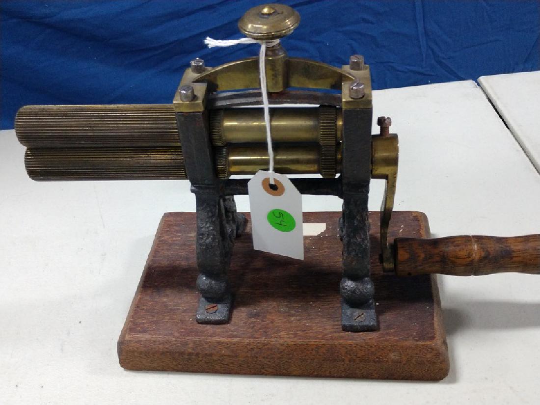 Iron - Machine Fluter: English Machine Fluter, Dal Purpose. Finer Teeth, Brass Rollers, Brass top with brass pressure screw top. Wood handle. Cast iron body mounted to a wood block.
