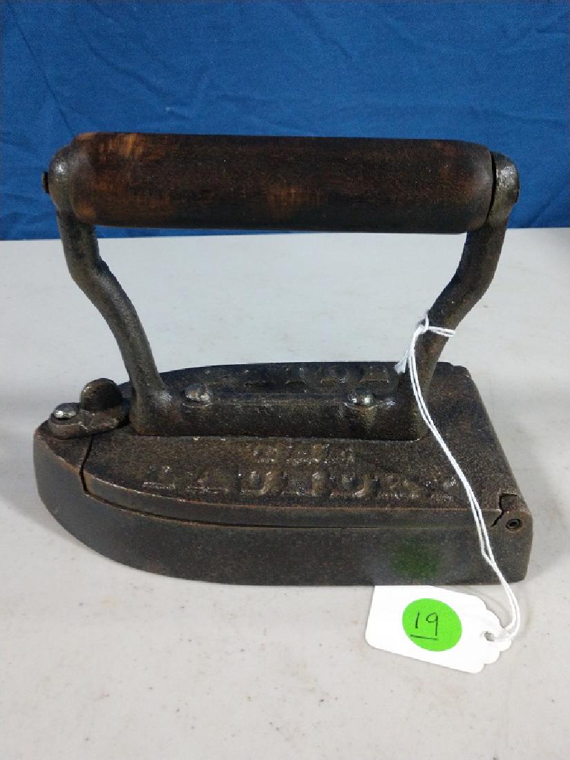 Iron - Pride of the Laundry: Iron with slug. Pat.d applied for. Handle turns.