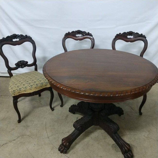 Furniture - Pedestal Table & 3 Chairs: Ornate pedestal table with 3 Rose back Mahogany Chairs. Pedestal Table is very ornate w claw feet on rollers.