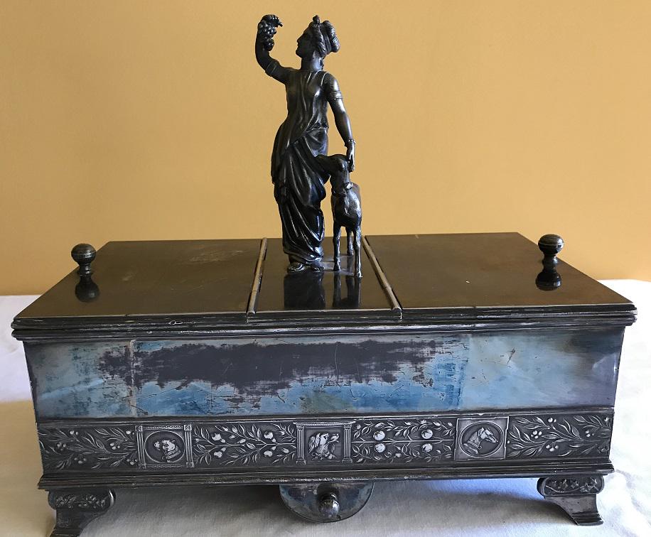 Silver Plate - Figural Humidor: Figural tobacco humidor, double sided with removeable sponge drawer. Footed, flowers on feet. Lady holding grapes with Lamb with head round bottom edge.
