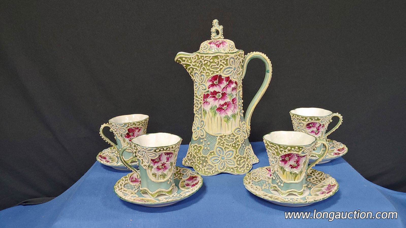 Nippon - Chocolate Set - 9: Unmarked Moriage Nippon Chocolate Set. 1 Chocolate Pot, 4 cups and 4 saucers. Has enamel beading, floral design on pot and cups.