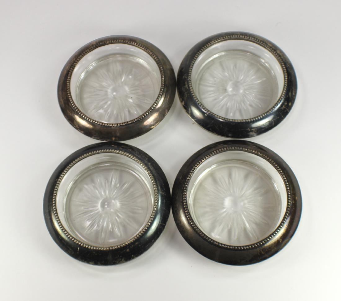 FOUR STERLING BEVERAGE COASTERS: Set of four Frank. M. Whiting & Co. Sterling 04 Pat Pending Beverage Coasters.