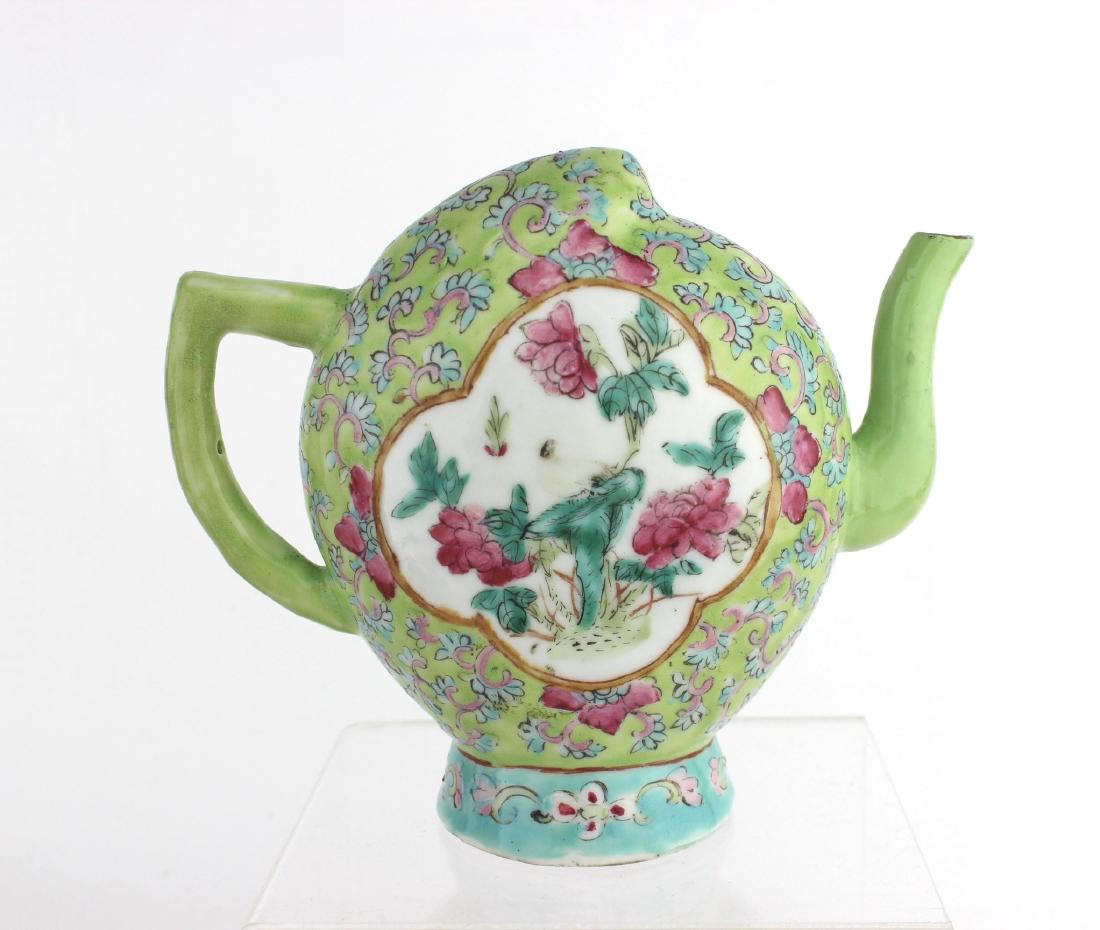 A CHINESE FAMILLE ROSE REFLUX POT: Depiction with kids playing and flowers in each sides. 5.5"H. Restoration on pot spout.