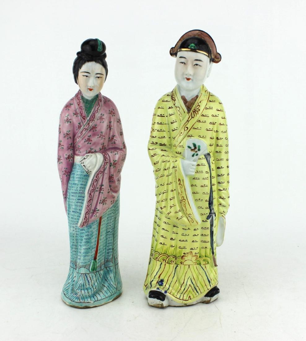 PAIR OF CHINESE PORCELAIN FIGURES: Both figurines with polychrome decoration. The 12" H male figure with impressed character mark "Hu Chang Shun Zao" and partial "China" on base, and with manufacturing hairlines on base near opening. T