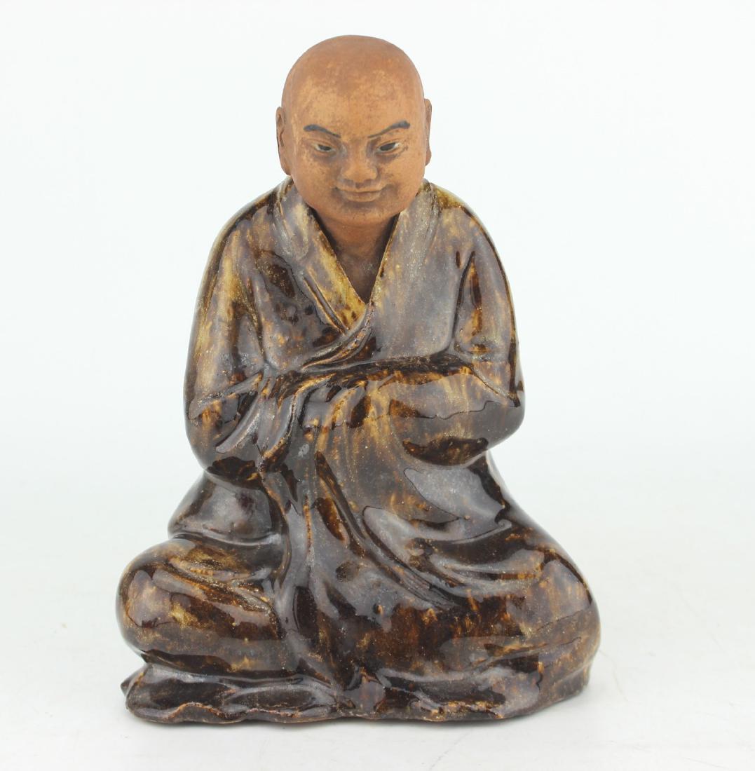 A CHINESE PORCELAIN BUDDHA FIGURINE (1 of 9)