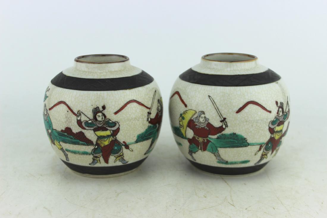 PAIR OF CHINESE FAMILLE VERTA JARS: The jars with warriors motif. Both jars with impressed four character mark "Cheng Hua Nian Zhi" on the bottom. Size: 4" H X 4.25" D. No visible damage.