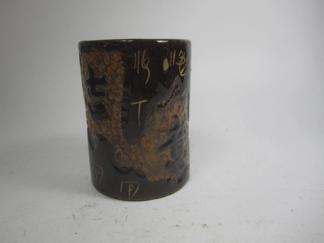 A JAPANESE ART BRUSH POT: The brush pot decorated with calligraphy. In good condition, 4" H X 3" D.