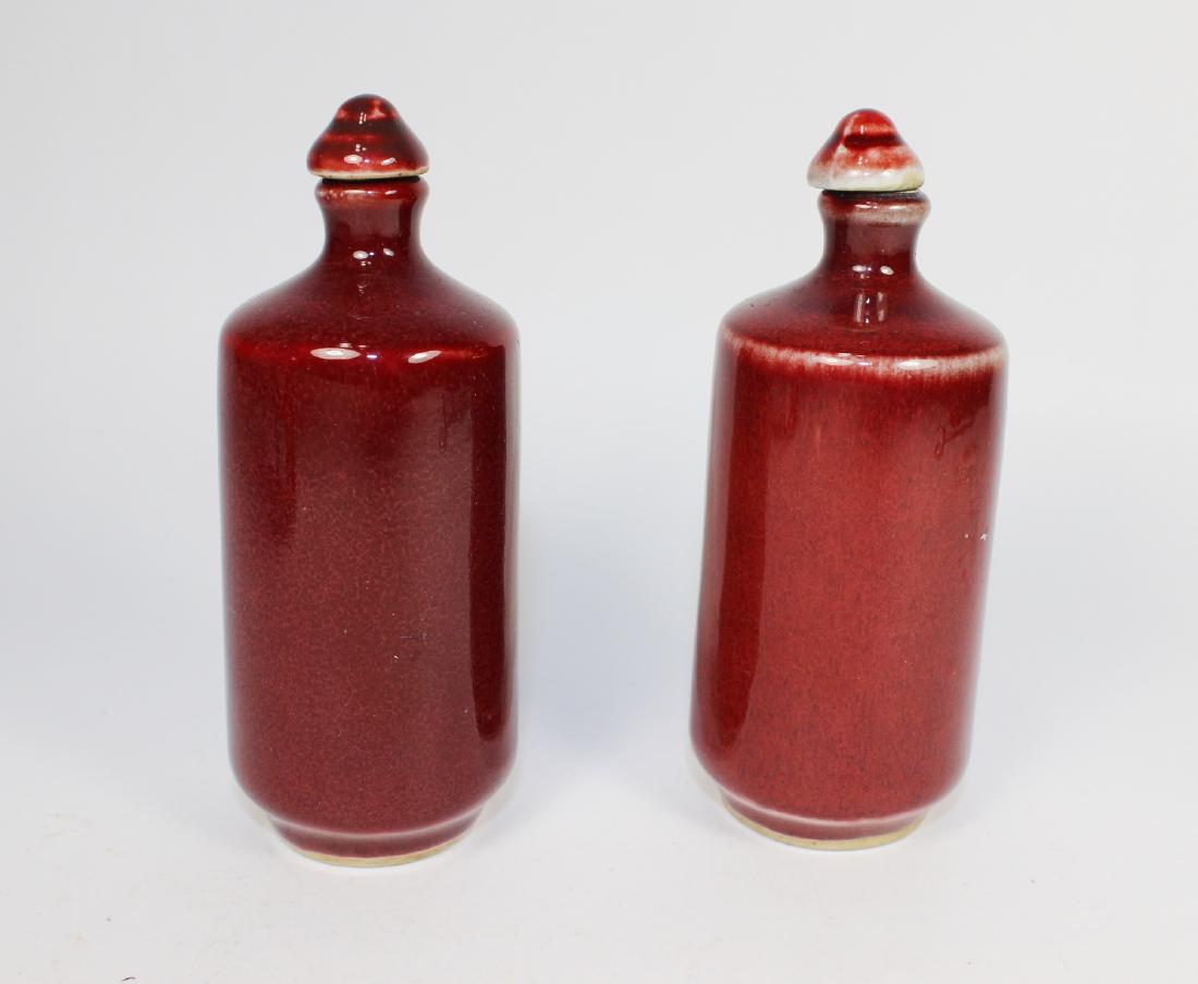 PAIR OF CHINESE SANG DE BOEUF SNUFF BOTTLES (1 of 6)