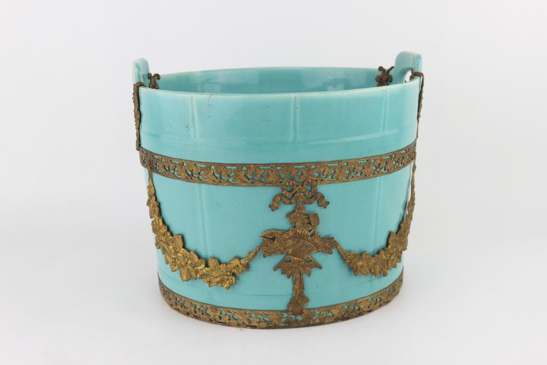 CHINESE TORQUOISE PLANTER: Ceramic with bronze applied ormolu banding and drapery, open handles, hairline in rim. 7"H X 8.25"D