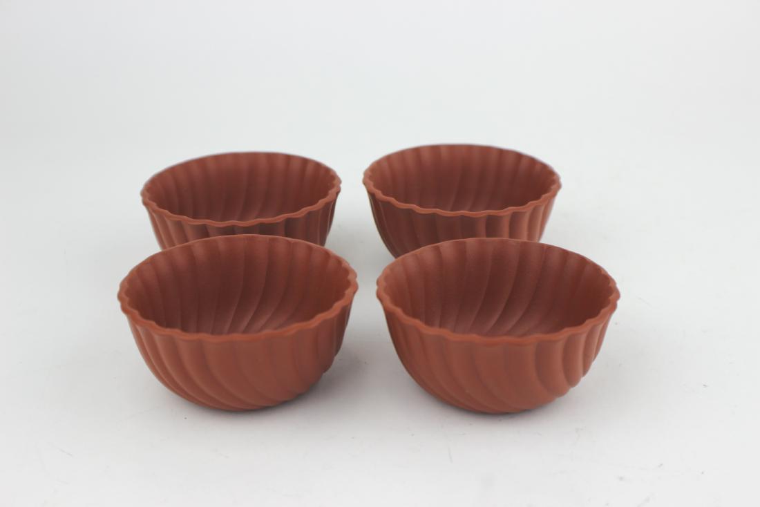 FOUR CHINESE ZISHA TEACUP SIGNED: Signed "CHEN XIE JUN". In good condition. 6,5 CM in diameter.