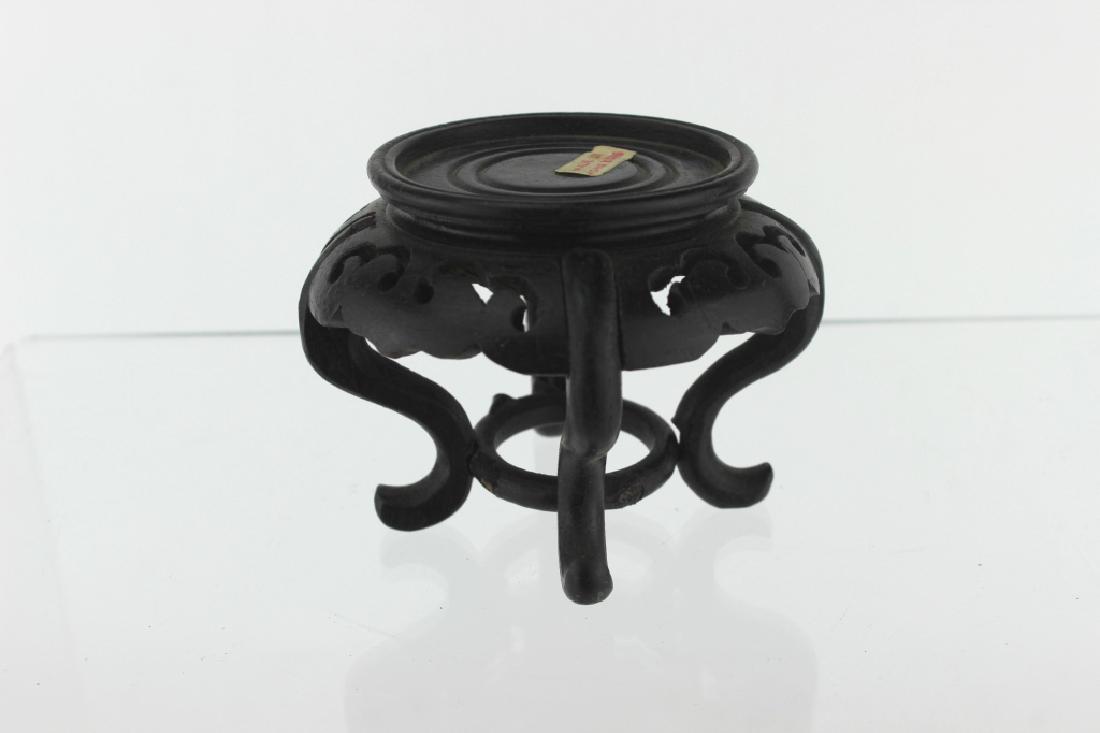 A CHINESE WOOD STAND: 3.25"D X 2.5" H