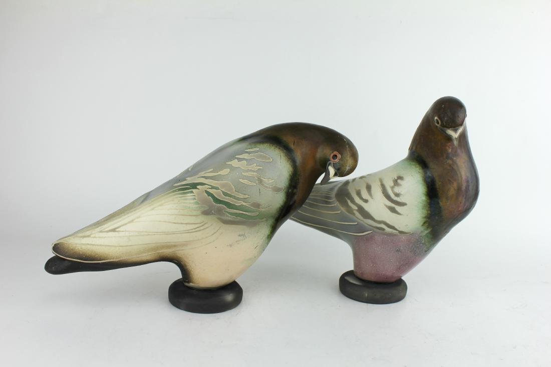 TWO GLO COALSON LIMITED ED POTTERY PIGEONS: Both vintage Glo Coalton pigeon sculptures are signed limited edition. One pigeon signed "41 Coalson 1997 c 219/250", measures 12 in. in length; another pigeon signed "45 Coalson 1997 c 203/250". meas