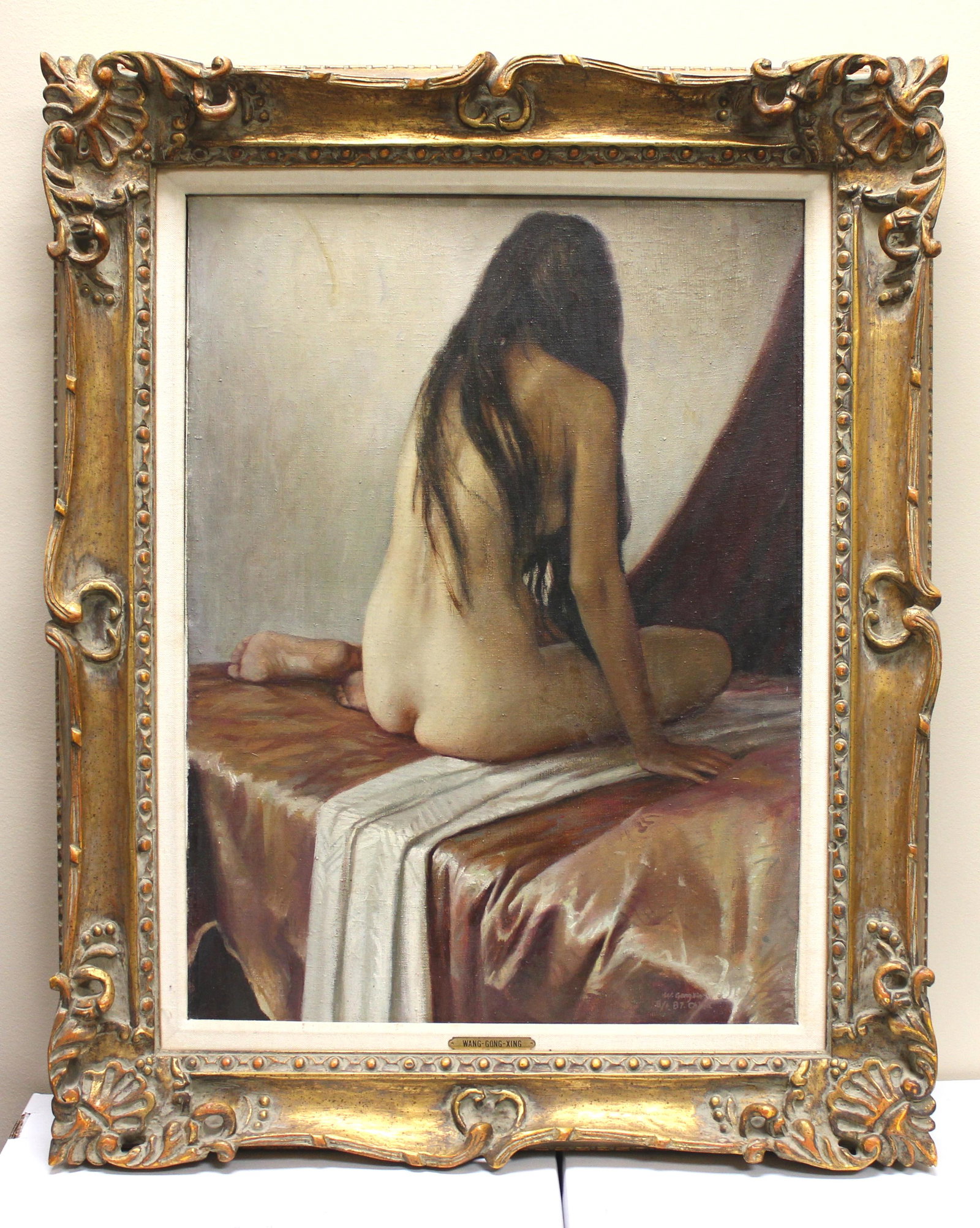 WANG GONG-XIN, FEMALE NUDE, OIL ON CANVAS: Wang Gong-Xin (Chinese, b 1960), "Female Nude", Oil On Canvas. Framed. Signed and dated lr "W. Gongxin, 8/1, 87. China." The painting size: 17 1/2 X 24 in.; the frame size: 25 X 30 3/4 in..