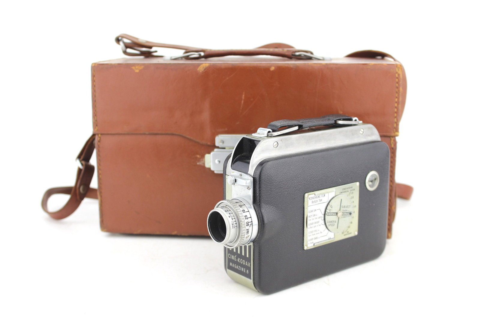 CINE-KODAK MAGAZINE 8 CAMERA: With f/1.9 Kodak Anastigmat lens and leather case. Size: 6 X 10 X 4 1/4 in..