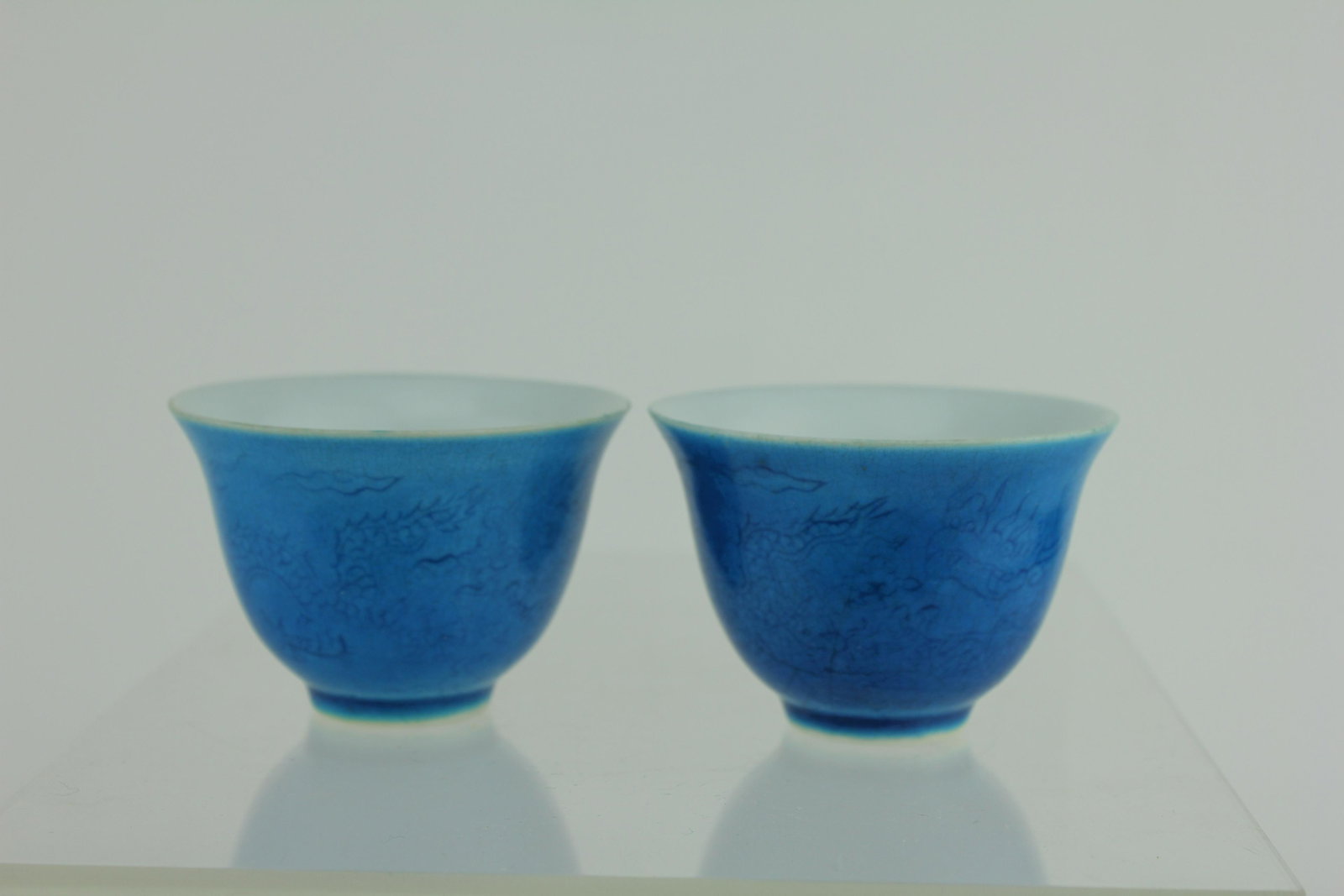 TWO BLUE GLAZE DRAGON CUPS: With blue six characters mark on the bottom. 1 3/4 in. H.