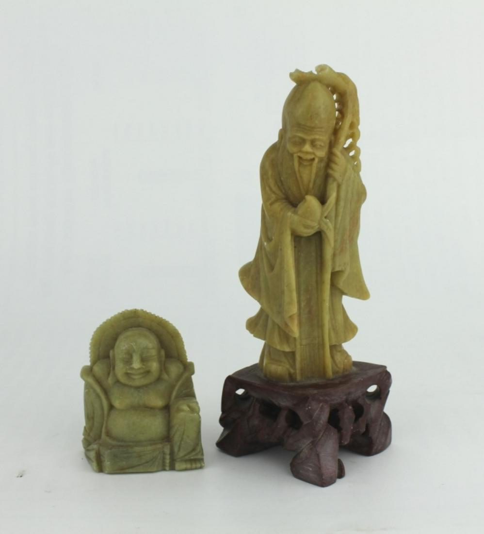 TWO CHINESE SOAPSTONE CARVED FIGURINES: One Buddha (2 1/4 in. in height), and one Longevity god (6 in. H).