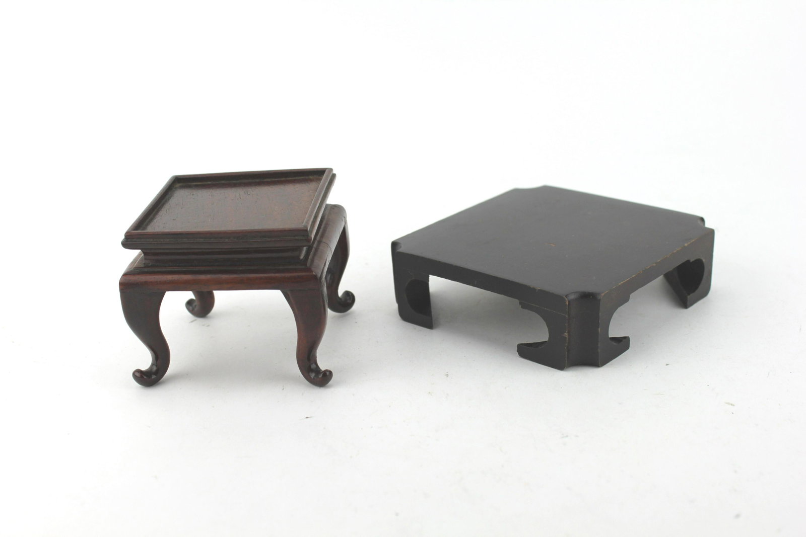 TWO CHINESE CARVED SQUARE STANDS: One taller stand measures approx. 3 X 3 X 2 1/4 in., another measures 4 X 4 X 1 in..