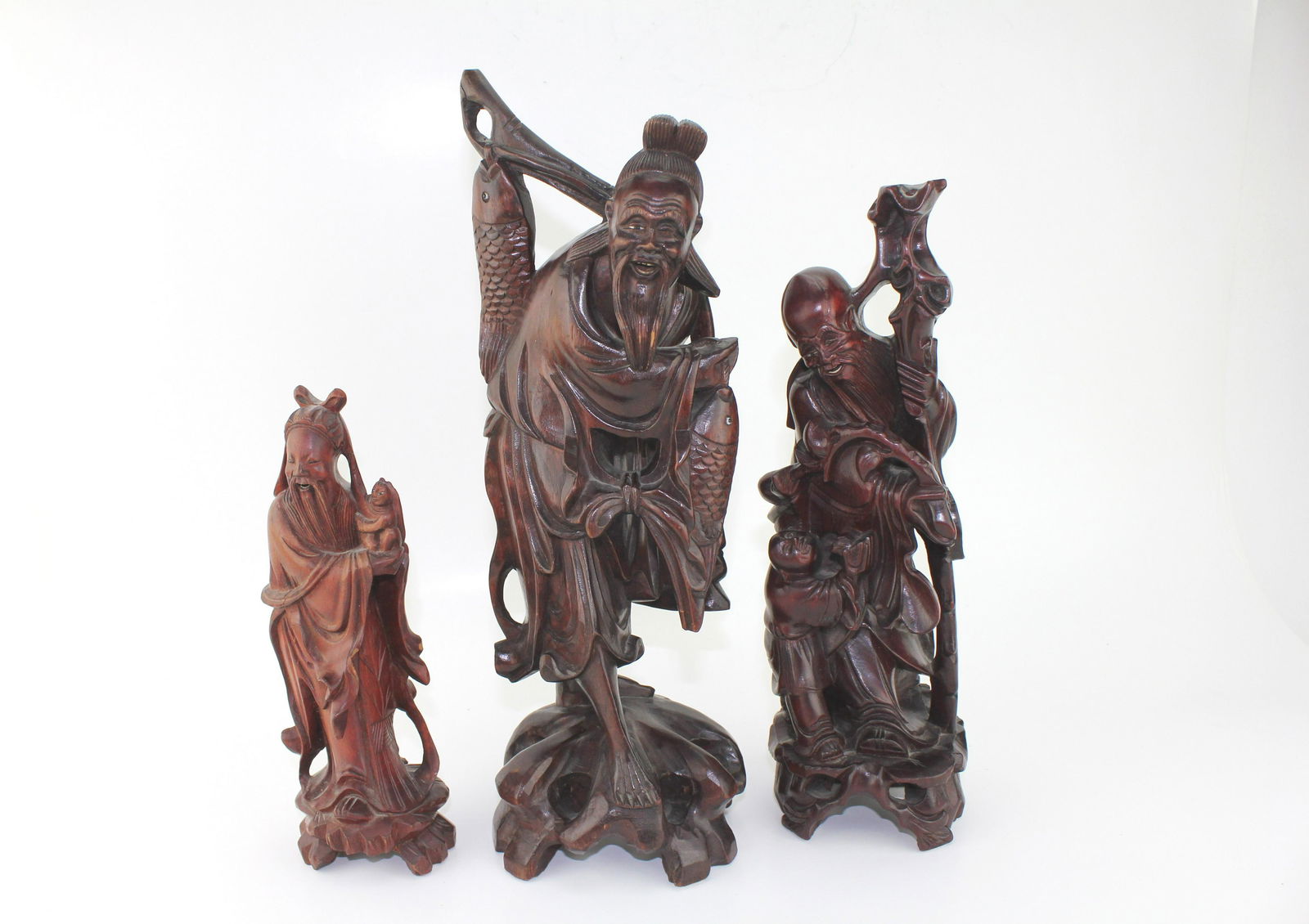 THREE CHINESE WOOD CARVED FIGURINES (1 of 13)