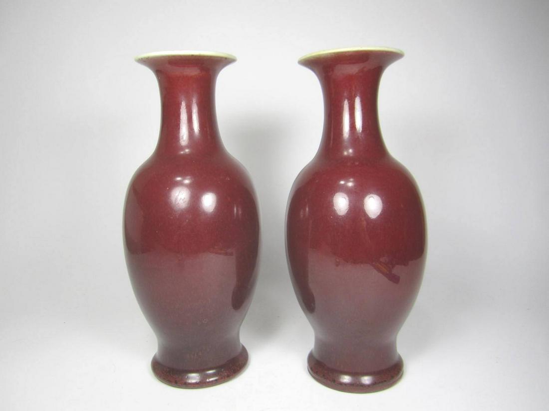 PAIR OF CHINESE SANG DE BOEUF VASES: Small crack in rim of one vase.9 1/2 in. in height.
