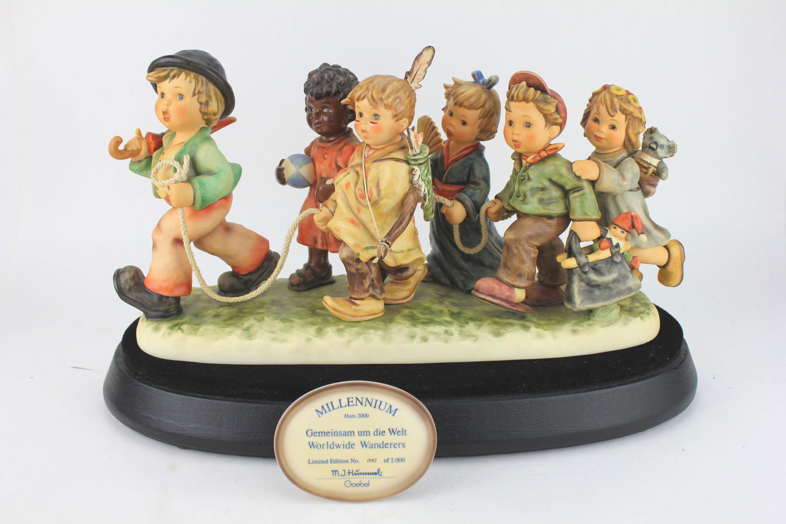 M.J.HUMMEL WORLDWIDE WANDERERS #1440 FIGURINE: M. J. HUMMEL Goebel, Millennium Hum 2000, Gemeinsam um die Welt, Worldwide Wanderers, Limited Edition No. 0143 of 2000. signed. In original box. In Very Excellent condition. The box measures 23 X 15 X
