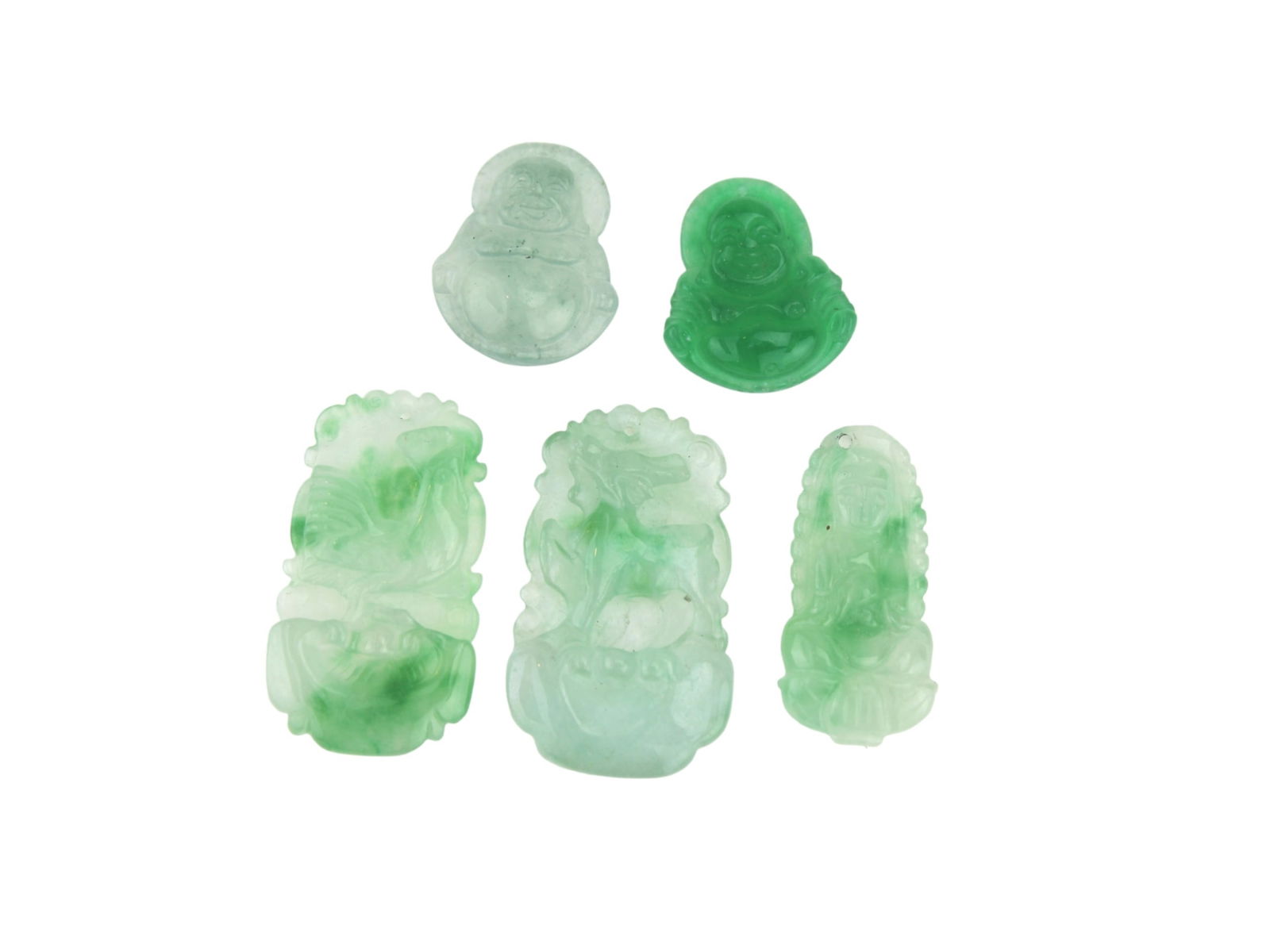 FIVE JADEITE CARVED PENDANTS: The largest one measures approx. 2 3/4 in. in length. Please see pictures for detailed conditions.