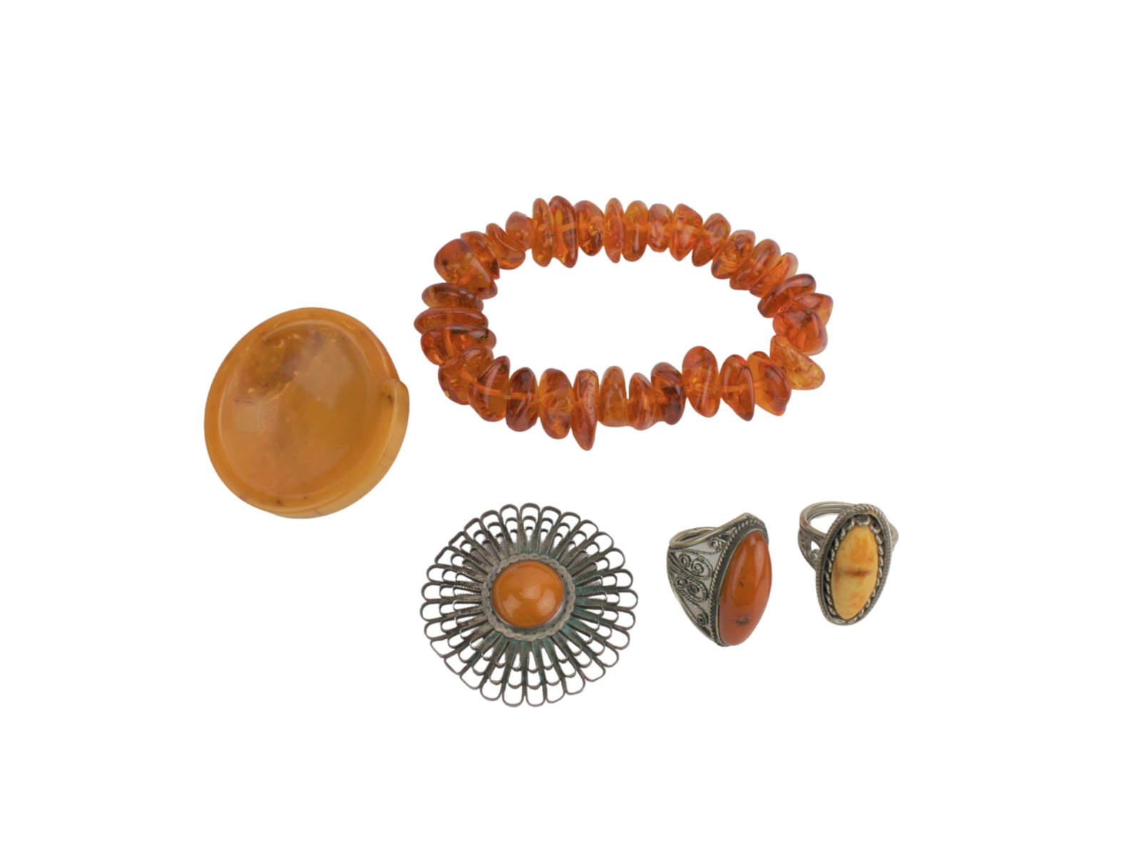 LOT OF AMBER JEWELRIES: Including 7 in. (L) bracelet, 1 3/4 in (L) carved snail container, 1 3/4 in. (L) Amber sterling pin, two rings. Please see pictures for detailed conditions.