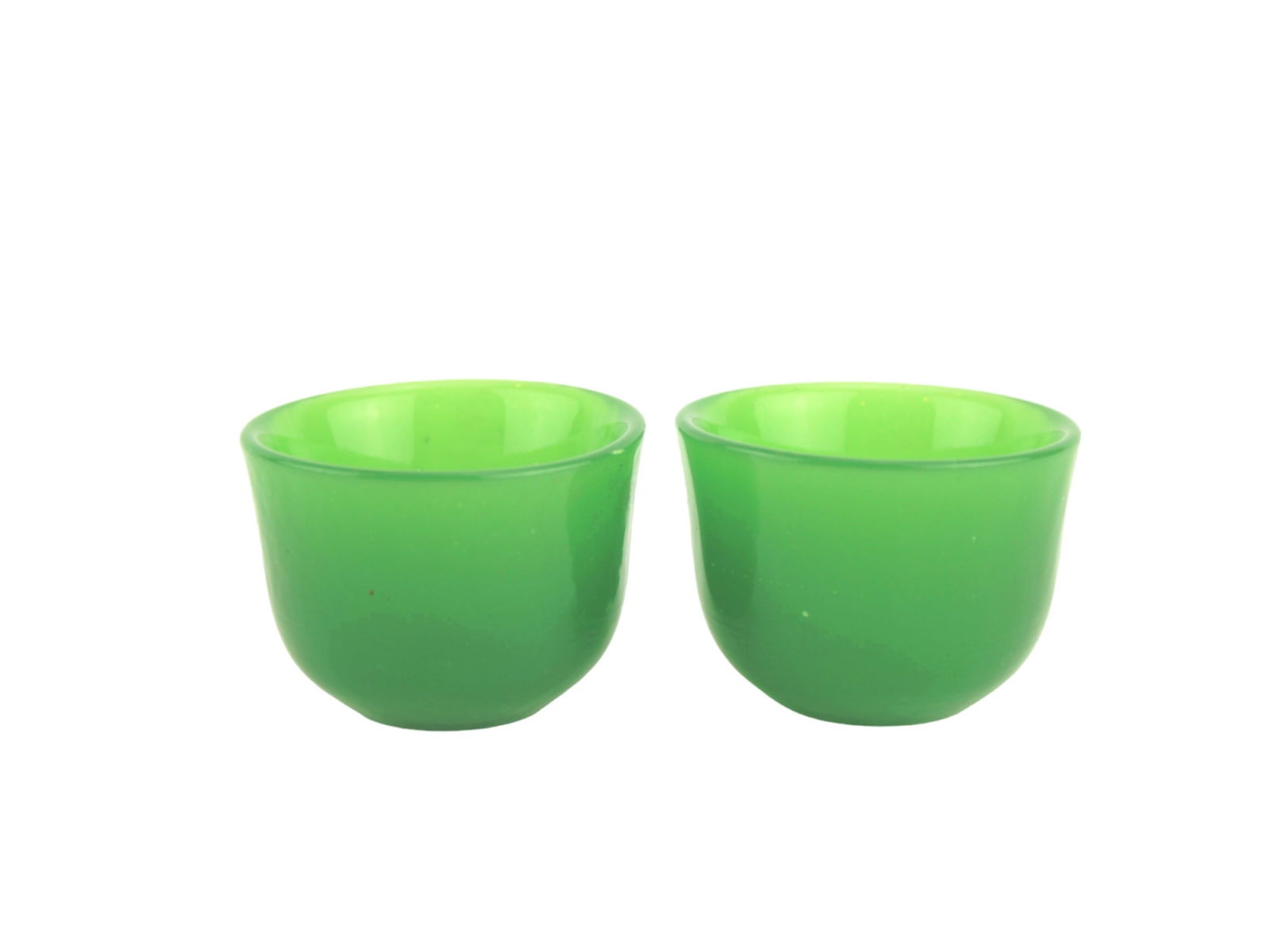 PAIR OF GREEN GLASS CUPS: 2 1/4 in. (D) X 1 1/2 in. (H).