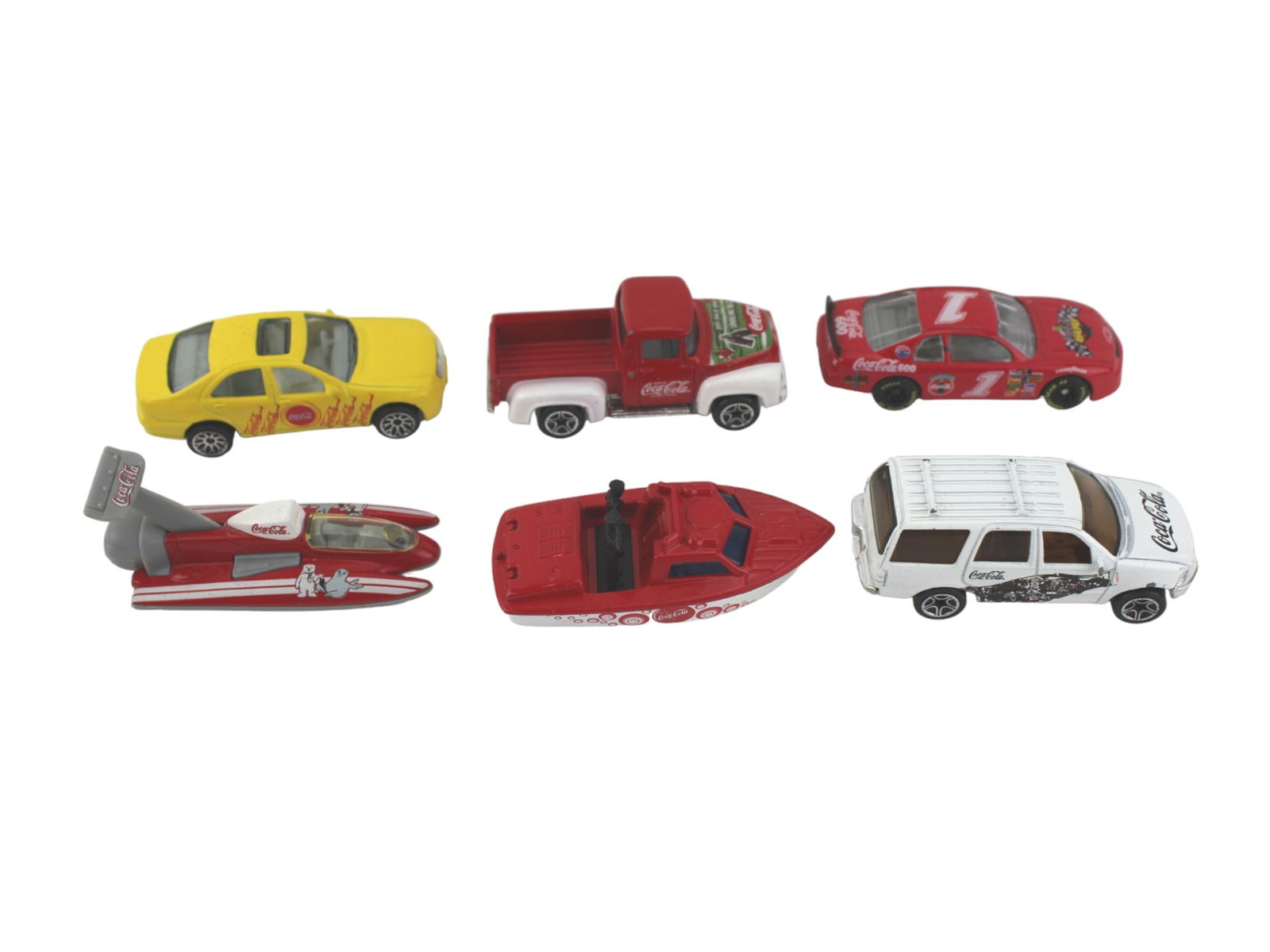 SIX COCA COLA COLLECTIBLE MODELS: Includes: four car models: 1999 Mattel Mercedes-Bens S500 1:65; 1998 Mattel Ford Expedition 1:68; 1996 Matchbox '56 Ford Pick-up; 1996 Revell 1996 Monte Carlo 1:65. two ship models: Matchbox 1976 Matt
