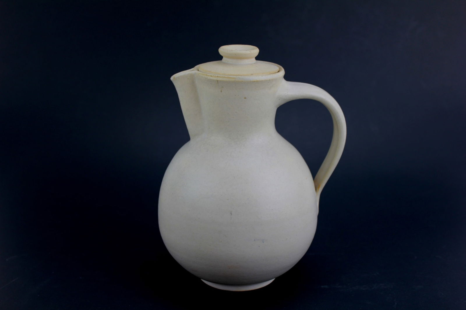 1920S STONEWARE COFFEE POT: Ca. 1920s, with mark of Bauhaus Carl Fischer Bürgel. 6 3/4 X 5 X 4 1/2 in. chips on lid.