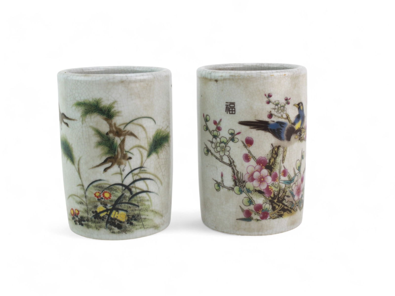 Pair of Chinese Famille Rose Brush Pots: The pot measures Approx. 4 1/2 in. (H). With six iron red six Chinese characters on the base.