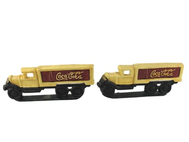 PAIR OF COCA-COLA CAST IRON TRUCK DOOR STOPS