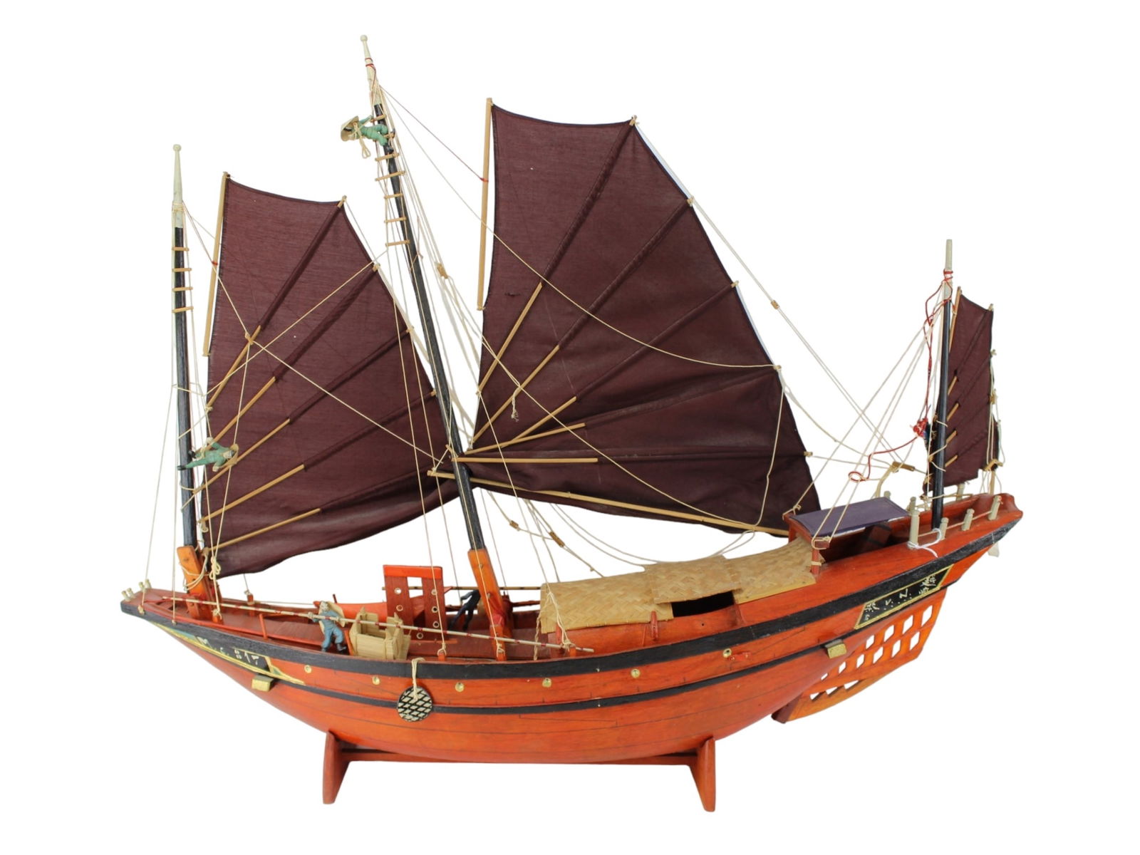 Large Handcrafted Vietnamese Junk Boat Model: Handcrafted wooden model of a traditional Vietnamese junk boat, featuring battened sails, miniature crew figures, bamboo deck covers, and detailed rigging. Shows signs of wear with visible cracking on
