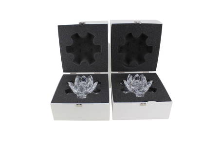 2 Swarovski Silver Crystal Lotus Tealight Holders: This pair of Swarovski Silver Crystal lotus-shaped tealight holders features intricately faceted clear crystal petals that shimmer with brilliance. Each piece is designed to hold a single tealight and