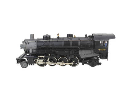Lionel 4529 HO Gauge Locomotive: This is a detailed Lionel O Gauge model train locomotive, numbered 4529. The engine features black bodywork with intricate molded and painted components, including a realistic cab with a miniature eng
