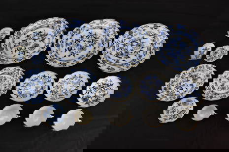 15 Pcs Meissen "Blue Onion" Pattern Porcelain Set: A 15-piece Meissen porcelain set in the classic Blue Onion pattern, featuring plates, cups, saucers, and small dishes with gilt trim. All pieces bear the Meissen crossed swords mark; some show minor w