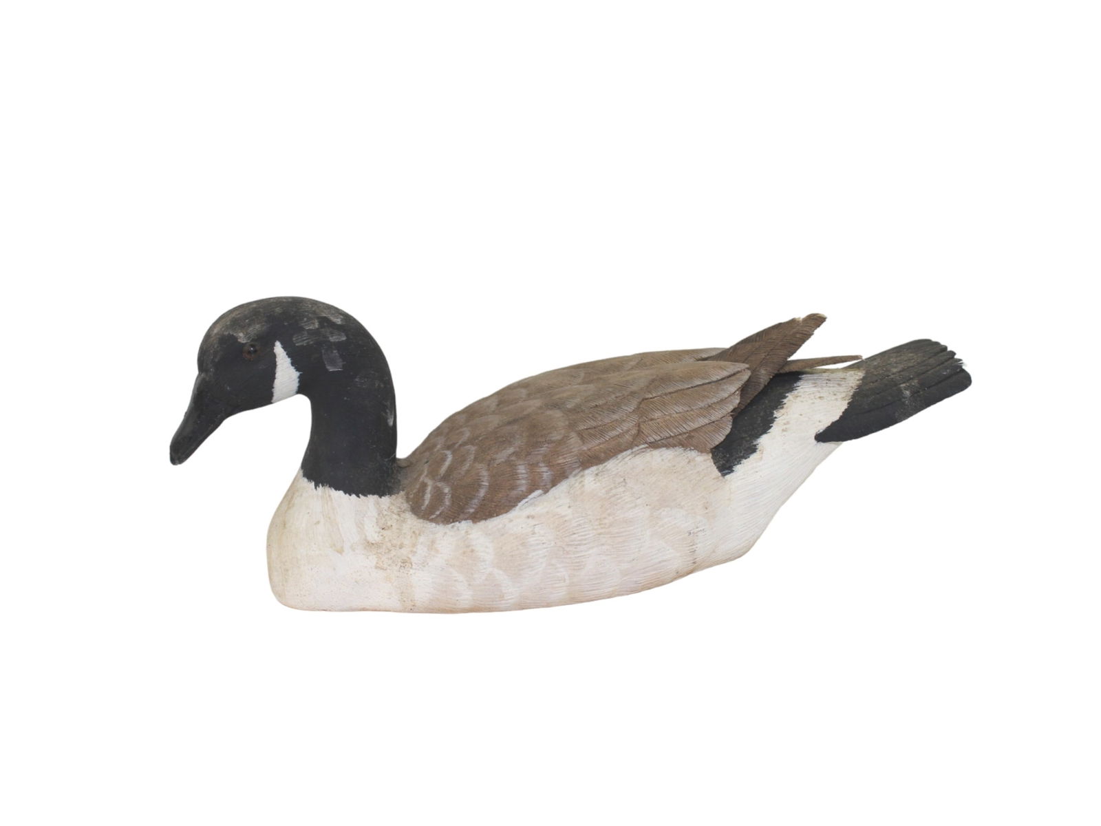 JERRY BREWINGTON, WOOD CARVED WATERFOWL DECOY: Signed "Jerry Brewington, 1990, Knoxville, TN." It measures approximately 9 1/2 X 3 3/4 X 3 1/2 in..