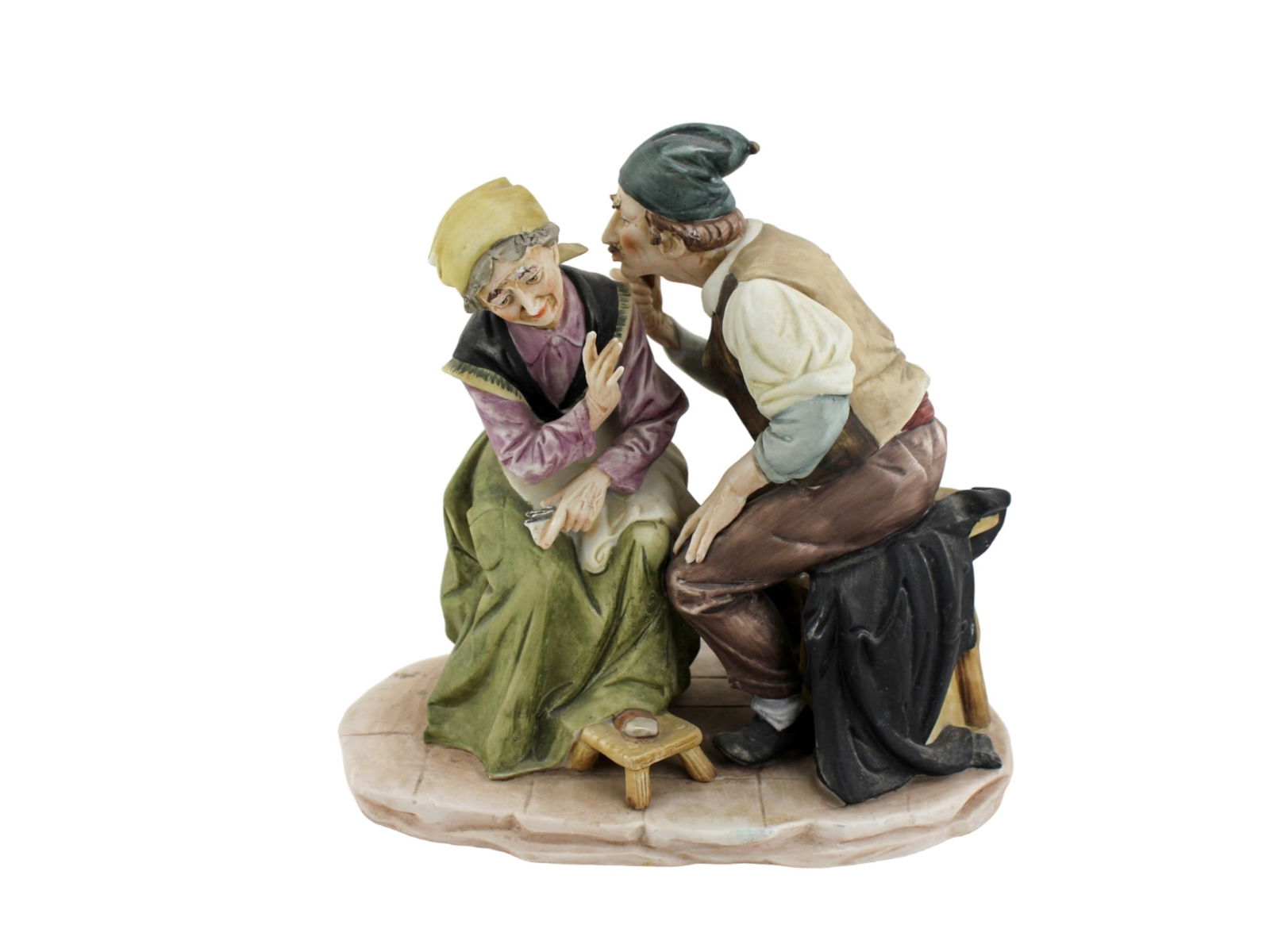 BRUNO MERLI CAPODIMONTE PORCELAIN FIGURINES: Hand-painted Capodimonte porcelain figurine showing a man whispering to a woman. Detailed and expressive, signed by the artist, and marked with the Capodimonte crown over "N" and numbered 44/59. A lim