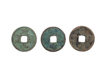 Three Ancient Chinese Bronze Coins: These three ancient Chinese cash coins are made of bronze or brass and feature the classic round shape with a square center hole. The obverse sides bear Chinese inscriptions Zheng-He-Tong-Bao indicati