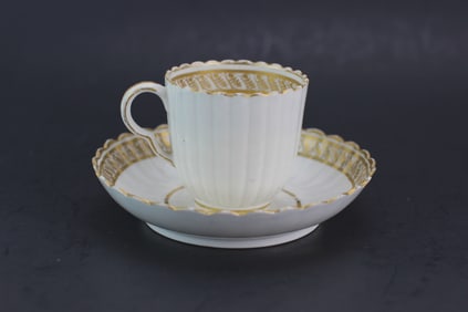 Porcelain Teacup and Saucer with Gilt Trim