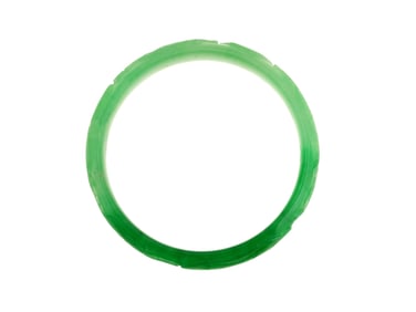 A Carved Green Jadeite Bangle Bracelet