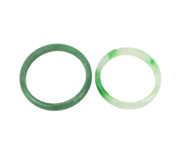 TWO GREEN JADEITE BANGLE BRACELETS