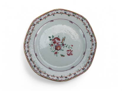 A Chinese Export Famille Rose Octagonal Plate: An octagonal Chinese Export porcelain plate, dating from the 18th century, features a delicate Famille Rose floral spray at its center, surrounded by a decorative border in iron-red, turquoise, and go