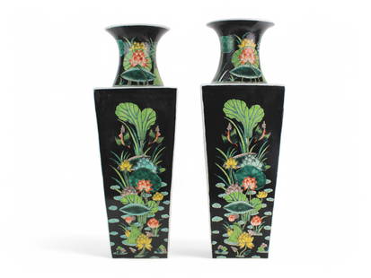 Pair of Chinese Famille Noir Square Vase: A striking pair of square porcelain vases decorated in the famille noire palette, each featuring vibrant lotus pond scenes with birds among lush aquatic flora, set against a rich black ground. The vas