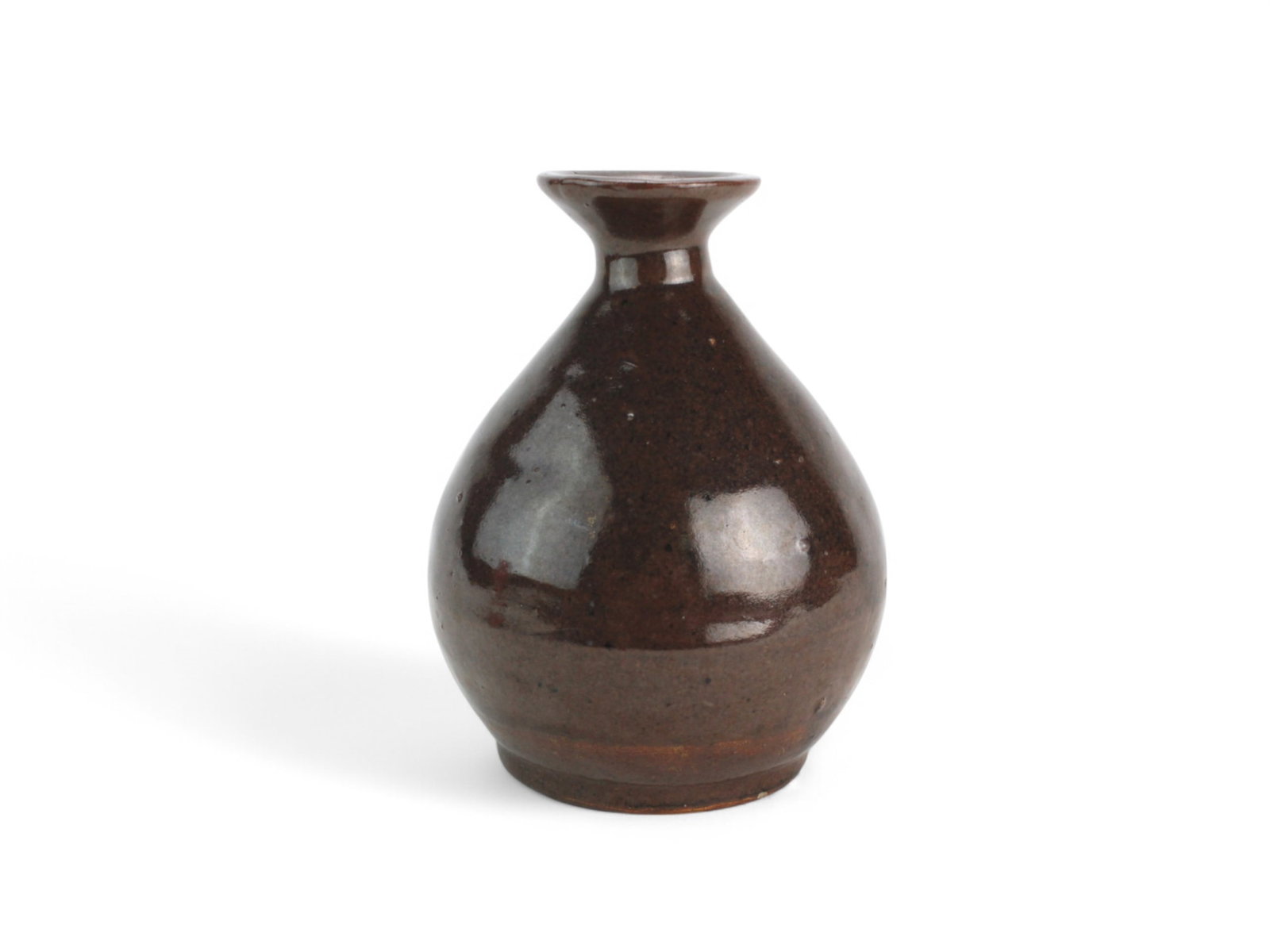 A Chinese Sung Dynasty Style Brown Glaze Jar: A small Chinese porcelain vase with a rounded body and narrow neck, finished in a rich, dark brown glaze. The glossy surface displays natural variations in tone and texture. It measures approximately 