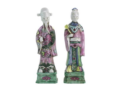 Pair of Chinese Famille Rose Figures: A pair of Chinese porcelain figures, each 8 inches tall, hand-painted in famille rose enamels. One figure features a long beard and dragon robe; another holds a ruyi scepter. Both stand on green bases