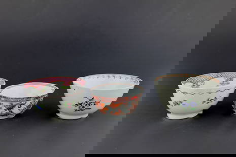 GROUP OF THREE CHINESE EXPORT TEA CUPS: Three 19th century Chinese export teacups, each hand-painted with floral designs in famille rose and iron-red palettes. One bowl has a hairline crack, others features a rim chip, and all show age-rela