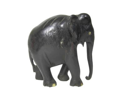 Small Black Wood Elephant: Hand-carved black wooden elephant figurine, measuring 5 in. H X 5.25 in. L X 2.5 in. W, showcasing simple features and slightly worn detailing.